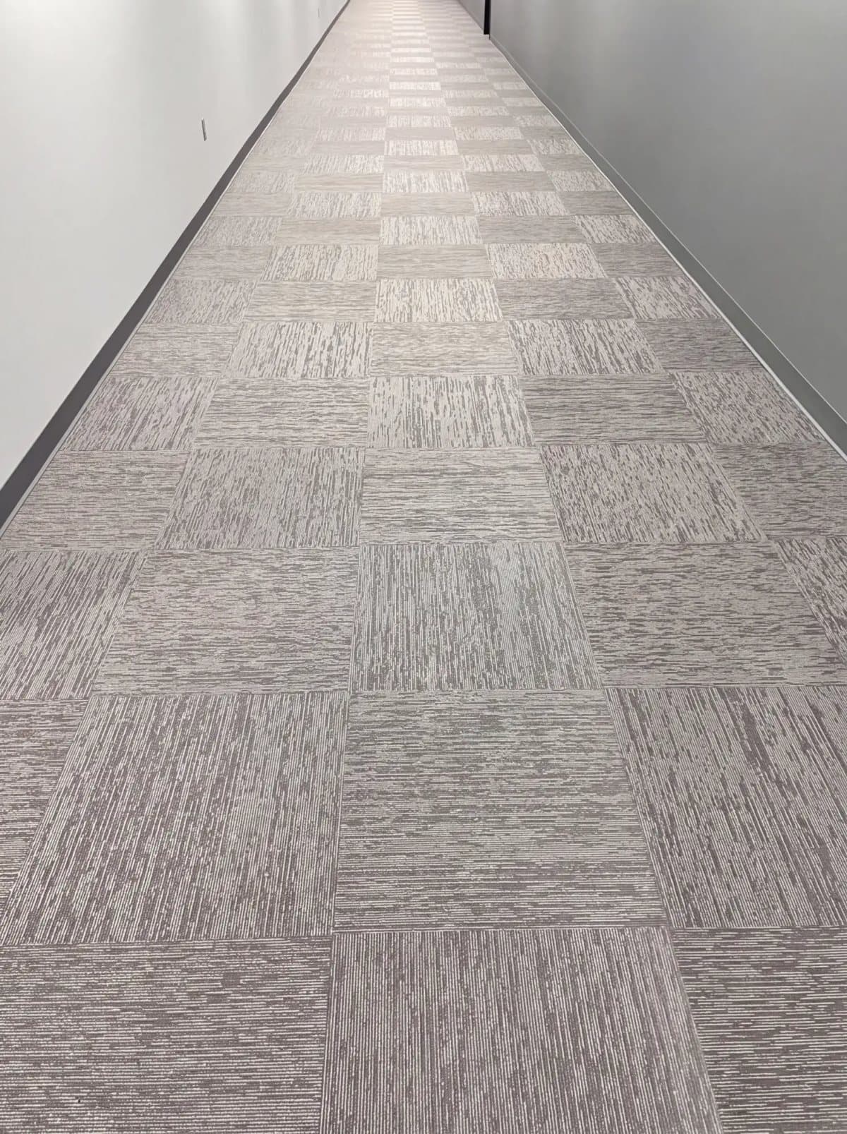 Illustrative example: the same corridor with clean, even carpet after hot water extraction