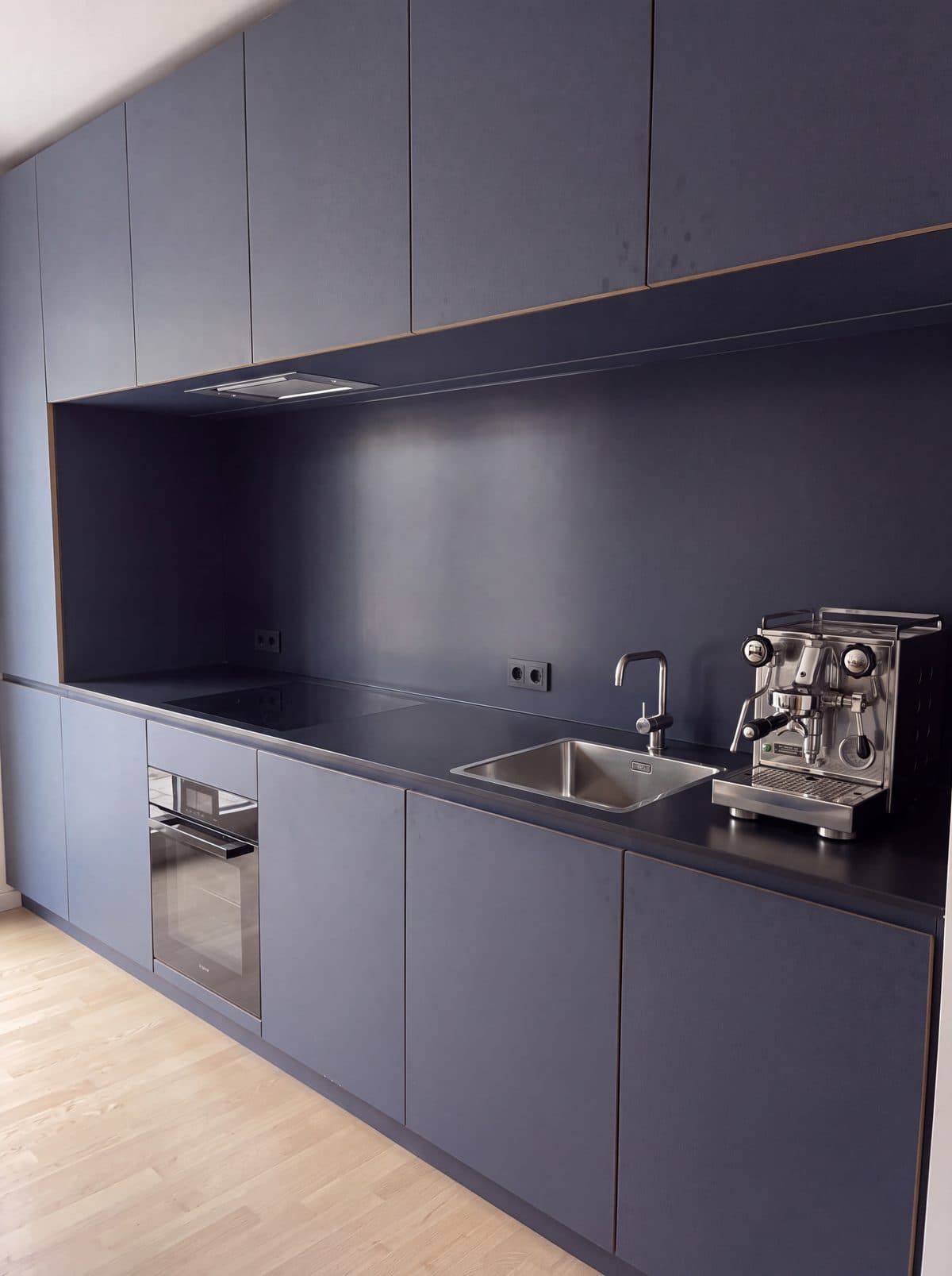 Illustrative example: the same office kitchenette clean and tidy after cleaning